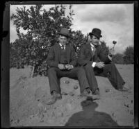 A man named Davis and Will Mead sit in a citrus grove, Glendale, 1898