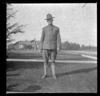 Unidentified solider stands on the West's front lawn, Los Angeles, about 1916