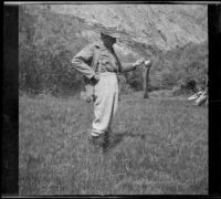 H. H. West posing with a trout from Reverse Creek, June Lake vicinity, 1913