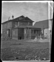 Arleigh Lemberger stands on the roof of the West's partially constructed house, Los Angeles, 1896
