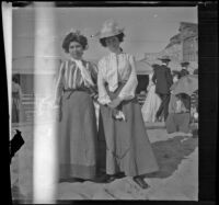 Lizzie Chandler and Nettie Davies stand in the sand, Santa Monica, 1901