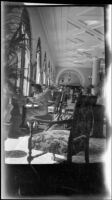 Mertie West sitting at a writing desk in the lobby of Chateau Lake Louise, Lake Louise, 1947