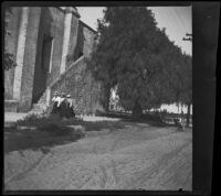 Women walking near the old stairs at San Gabriel Mission, San Gabriel, about 1896