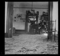 Wilson West and Wayne West sit at the table in the library of the West's house at 240 Griffin Avenue, Los Angeles, 1899