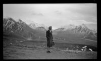 Mertie West looks for Mt. McKinley (Denali) from an overlook, Denali National Park and Preserve, 1946