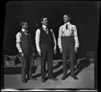 Ora Prickett and two other men stand outside a market, Fresno, 1901