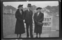 Mertie West, Wes Witherby and Zetta Witherby pose for a photograph at the Boulder Dam, Boulder City vicinity, 1939