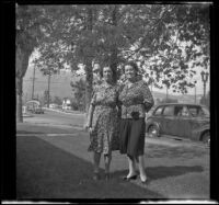 Lydia Kulp and Mrs. George Earl Freeland pose on the Kulp's front lawn, Glendale, 1943