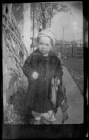 H. H. West Jr. holds two birds, Los Angeles, about 1919 — Calisphere