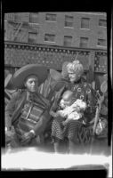 Dr. Bim Smith in his backyard with his mother who holds a baby, Los Angeles, 1939