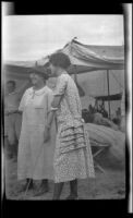 Mertie Whitaker and Zetta Witherby stand around their campsite at Abalone Point, Laguna Beach, 1924