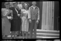 Mrs. H. H. West, Frances West Wells, H. H. West, Jr., Mrs. H. H. West, Jr. and Richard Siemsen pose on the front steps outside a church, Los Angeles, 1946