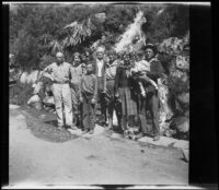 H. H. West and his family pose in front of a small waterfall along Lee Vining Creek, Yosemite National Park, 1929