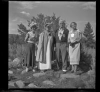 Mertie West, Josie Shaw, Forrest Whitaker and Agnes Whitaker posing in their "formal" attire, Mono County, 1941