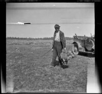 H. H. West standing with the limit of sage hen, Lassen County, 1917