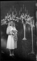 Ann Roth (Mrs. H. H. West, Jr.) poses at the alter on her wedding day, Los Angeles, 1945