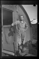 H. H. West, Jr. poses outside his quarters (negative), Dutch Harbor, 1943