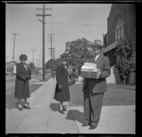 Josie Shaw, Mrs. Estes and W. H. Shaw stand outside Asbury Methodist Church, Los Angeles, 1944