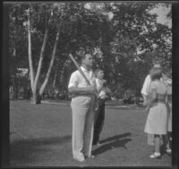 Everett Shaw holds a baseball bat in Victory Park, Los Angeles, 1931