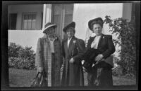 Frances Cline Greene, Mertie Whitaker West and France West Wells pose in front of W. W. Witherby's residence, Los Angeles, 1943