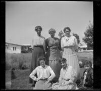 Alice Schmitz, Bessie Velzy, Kate Schmitz and three other women pose on the Velzy's front lawn, Los Angeles, about 1915