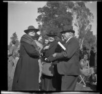 Alice Baltzell Tibbetts, Fannie Mead Biddick, and William Biddick stand together at the Iowa Picnic in Lincoln Park, Los Angeles, 1939