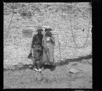 Floyd Purdy and Mrs. H. H. West (Mary Adelbert) pose for a photograph at the San Juan Capistrano Mission, San Juan Capistrano, about 1912