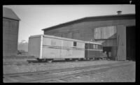 Automobile powered special train sits on the tracks outside a railroad storage facility, Whittier, 1946