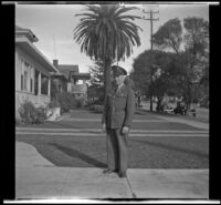 Gilbert Cecil West stands in uniform on H. H. West's front walk, Los Angeles, 1941