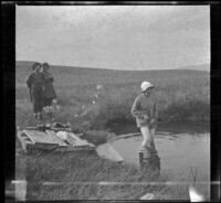 Bessie Velzy wades into Whitmore Tub while Frances and Elizabeth West watch, Mammoth Lakes vicinity, 1914