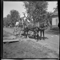 H. H. West, Wilhelmina Lemberger West, and Silas Hill ride in a buggy, Burlington, 1900