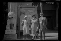 Mertie, Myrtle, and Evert West stand in front of Grauman's Chinese Theatre, Los Angeles, 1941