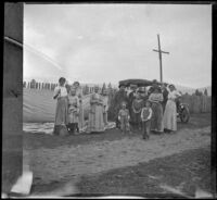 Mary Bidwell, Frances, Mary, Wilhelmina, and Elizabeth West, and Adolph and William "Babe" Bystle stand with others in front of a car, Shasta County vicinity, 1915