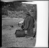 Charles Davis of Indianapolis rests his feet, Acton, about 1906