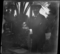 Dr. Bim Smith holds what may be a hamster or gerbil in Lincoln (Eastlake) Park, Los Angeles, 1899