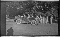 Wilfrid Cline, Jr. and Harry Schmitz standing in front of the car, Cisco, 1917