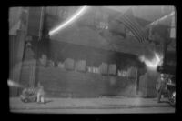 H. H. West walks in front of the Paul Revere House, Boston, 1947