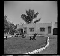 Mertie West stands outside the West's cabin at McCoy's Motor Court, Phoenix, 1942