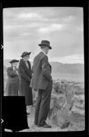 Zetta Witherby, Mertie West and Wes Witherby stand and look out onto the Lake Mead reservoir, Boulder City vicinity, 1939