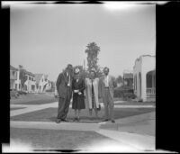 W. L. Kinsell, Mertie West, Anna West and H. H. West, Jr. pose outside H. H. West's residence, Los Angeles, 1947