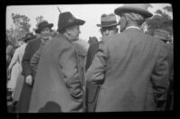 Helen Cook and Harry D. Cook speak to other attendees of the Iowa Picnic in Lincoln Park, Los Angeles, 1939