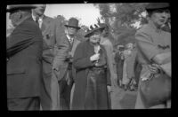 Ralph Hiatt stands behind other attendees of the Iowa Picnic in Lincoln Park, Los Angeles, 1940