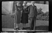 Dode Witherby, Mertie West and Wes Witherby pose in front of W. W. Witherby's residence, Los Angeles, 1943