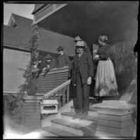 Group stands on the front porch of the West's house, Los Angeles, 1897