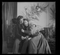 Minnie Kellum and Daisy Kellum sit on their sofa and perform a scene from a play, Los Angeles, about 1899