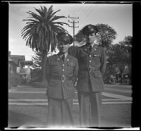 Close-up of Gilbert Cecil West and William Roscoe Wright standing in uniform on H. H. West's front walk, Los Angeles, 1941