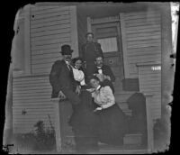 Charles Wilde, Daisy Kellum, Lucretia Kellum, H. H. West and Minnie Kellum pose on the Kellum's front porch, Los Angeles, about 1899