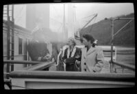 Mertie West, Frances Wells and a ship's officer converse on the bridge of the Aleutian, Valdez, 1946