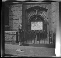 Mertie West standing at entrance to First Methodist Church, Boston, 1947