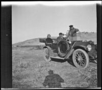 Dave F. Smith, H. H. West and Dr. F. S. Hardin pose for a photograph in H. H. West's Buick, Gorman vicinity, circa 1910s